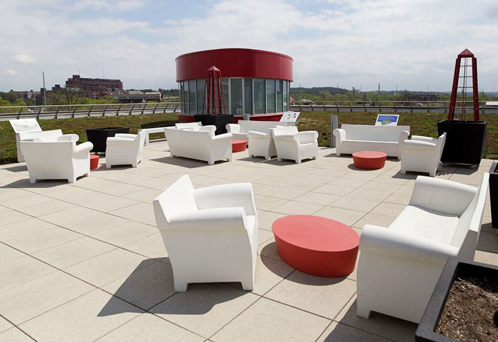 Living Learning Roof space showing various white chairs and red tables