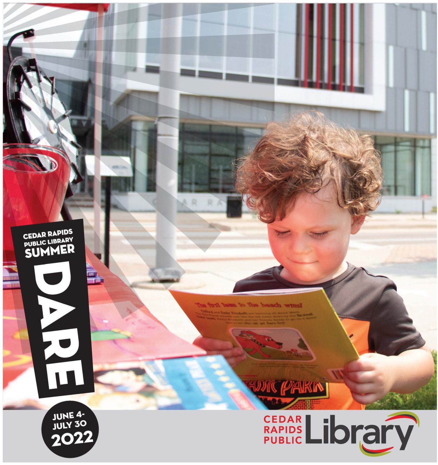 A boy with curly hair looks at a book next to an icon for Summer Dare 2022.