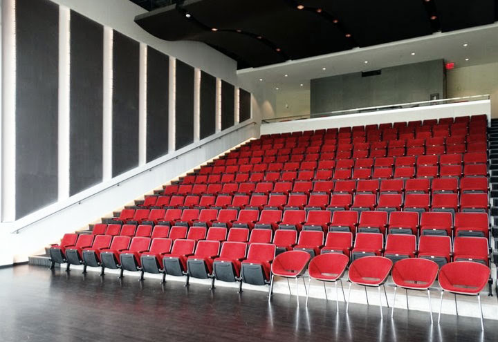 Whipple Auditorium image showing an auditorium space with red chairs