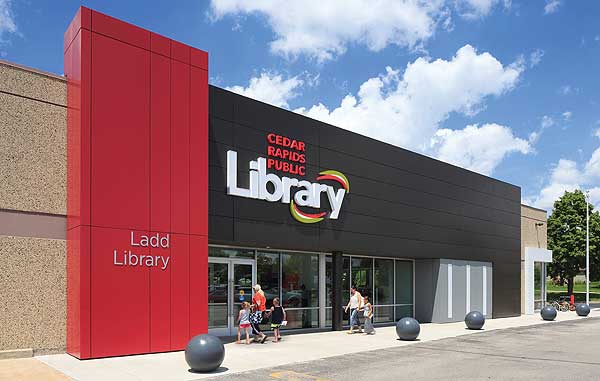 Ladd Library is a red and brown fronted building in front of a blue sky.