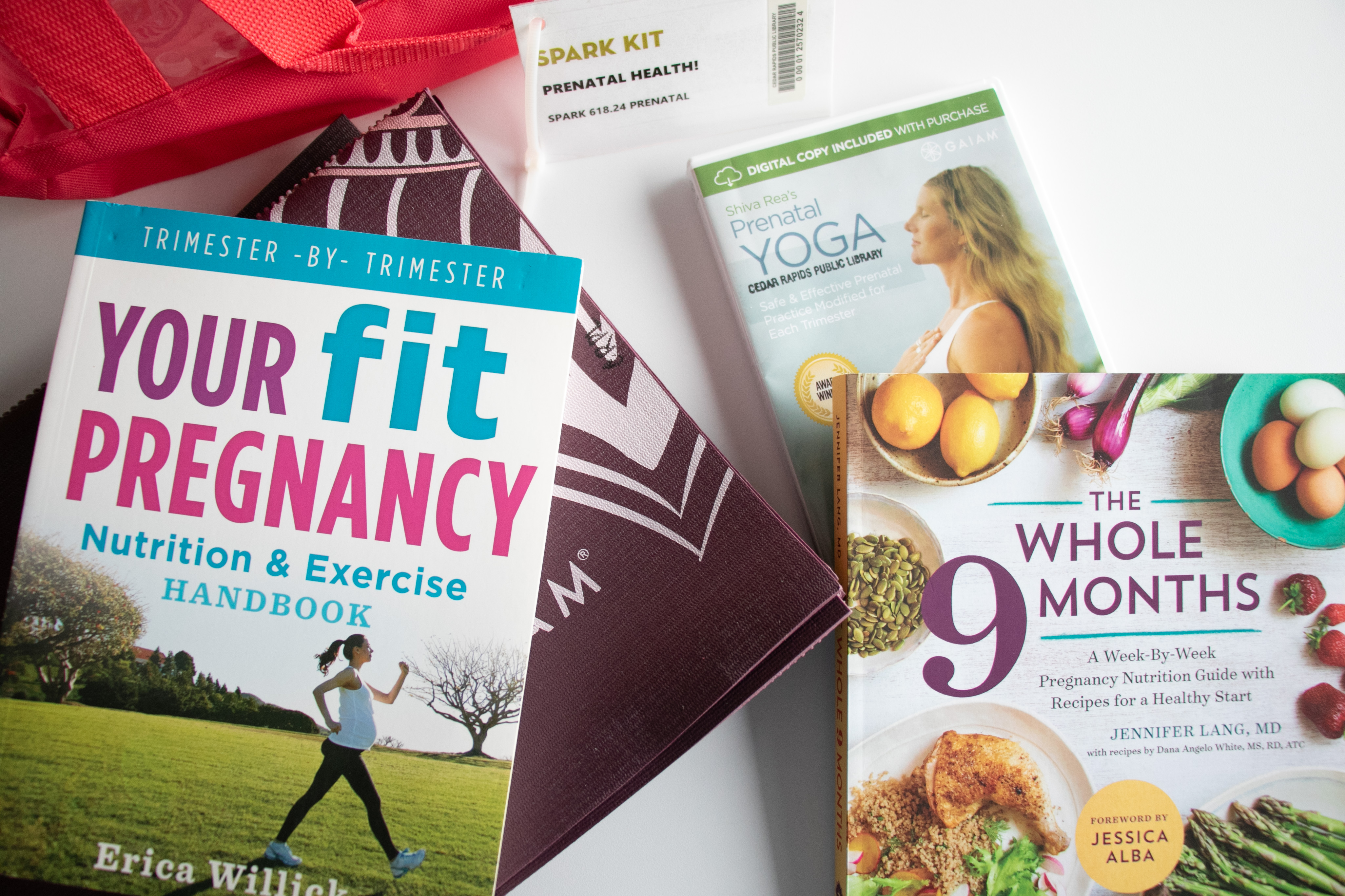 Several health books and a DVD sit on a table.