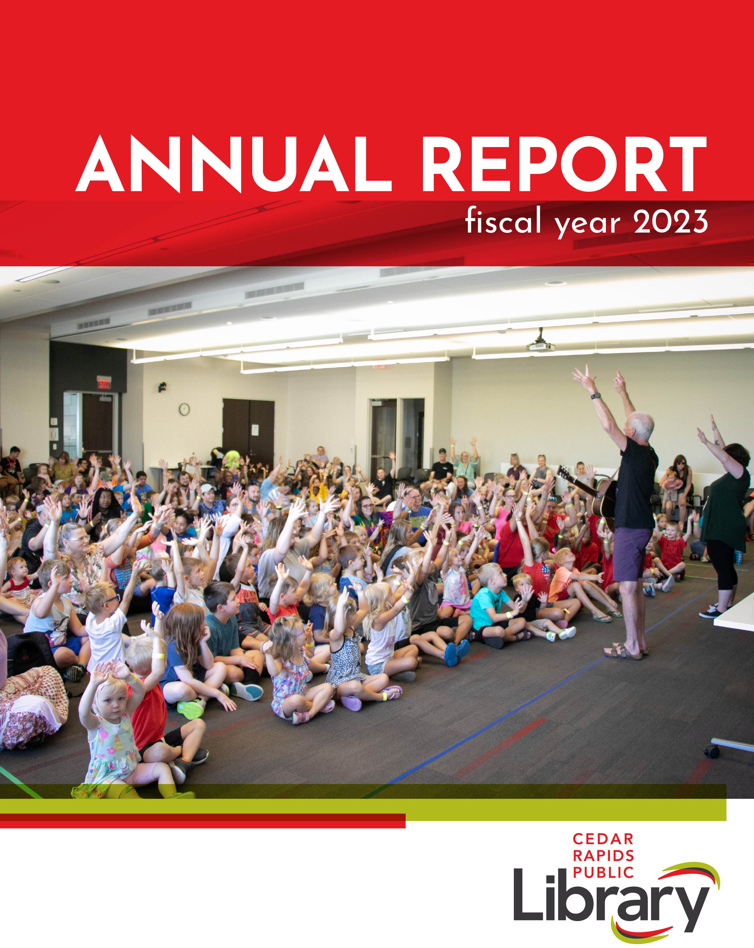 Cover of the FY2023 Annual Report, group of children watching a performance in the library