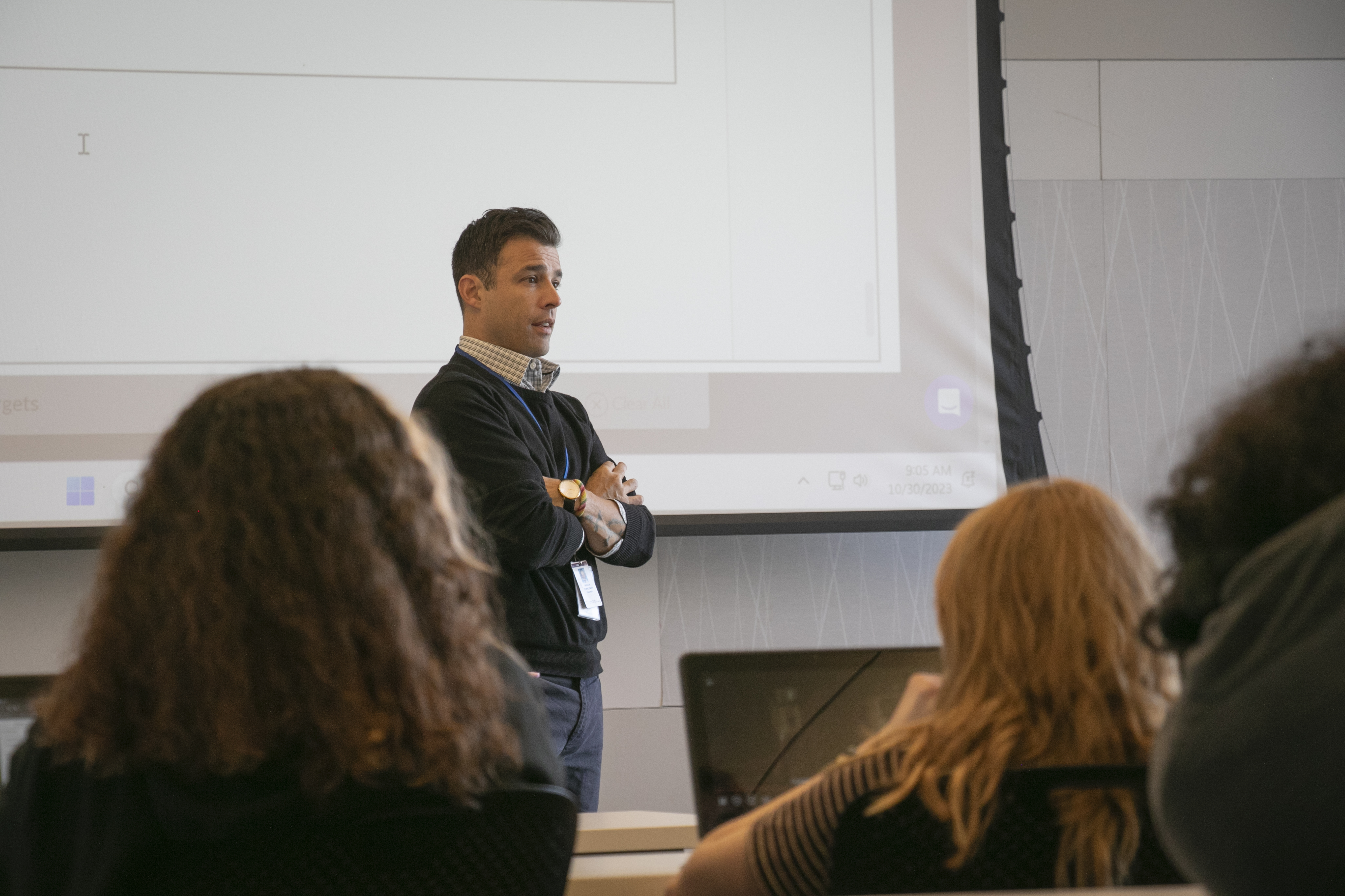 A teacher talks to a class at the Downtown Library.