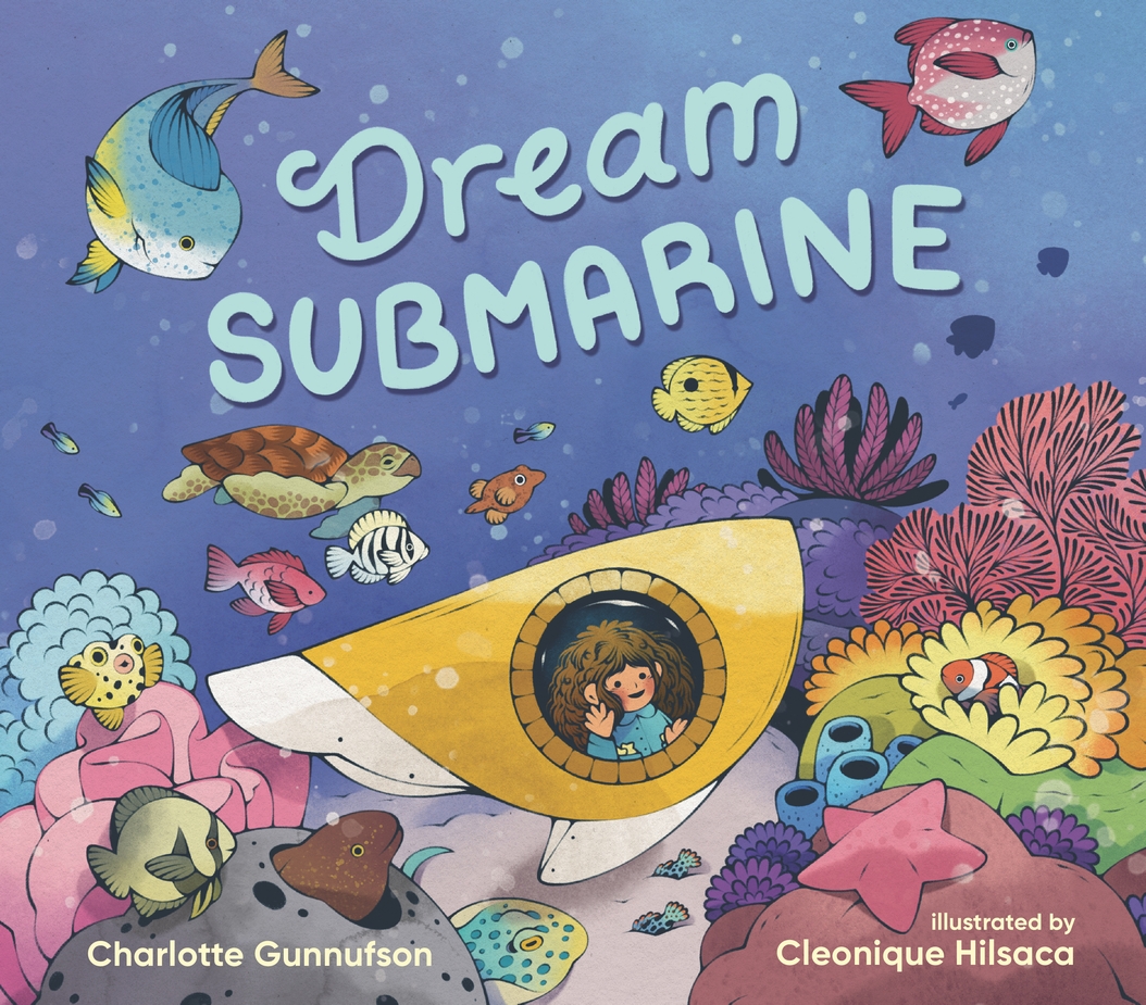 A picture book cover says "Dream Submarine" with an illustration of a girl looking out a submarine window at an ocean full of fish.