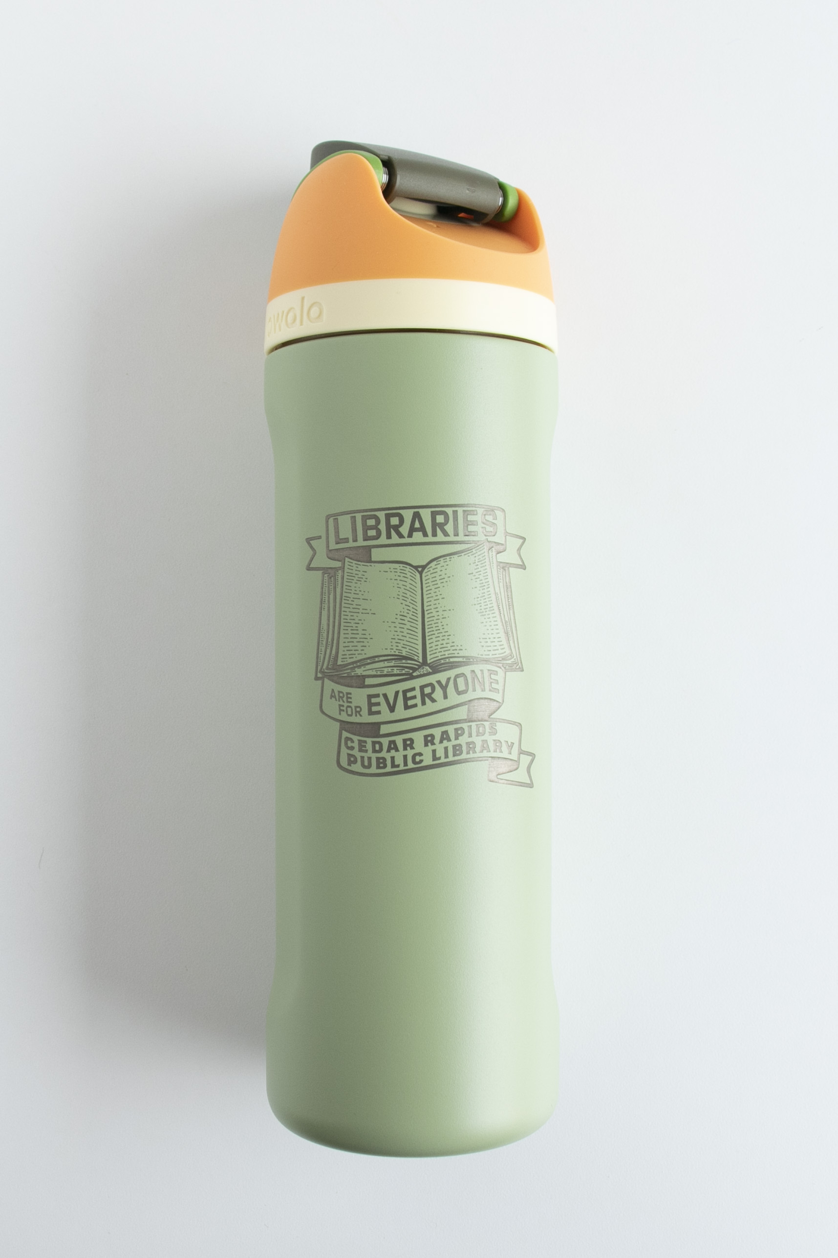 A green water bottle has "Libraries are for Everyone" engraved on it.