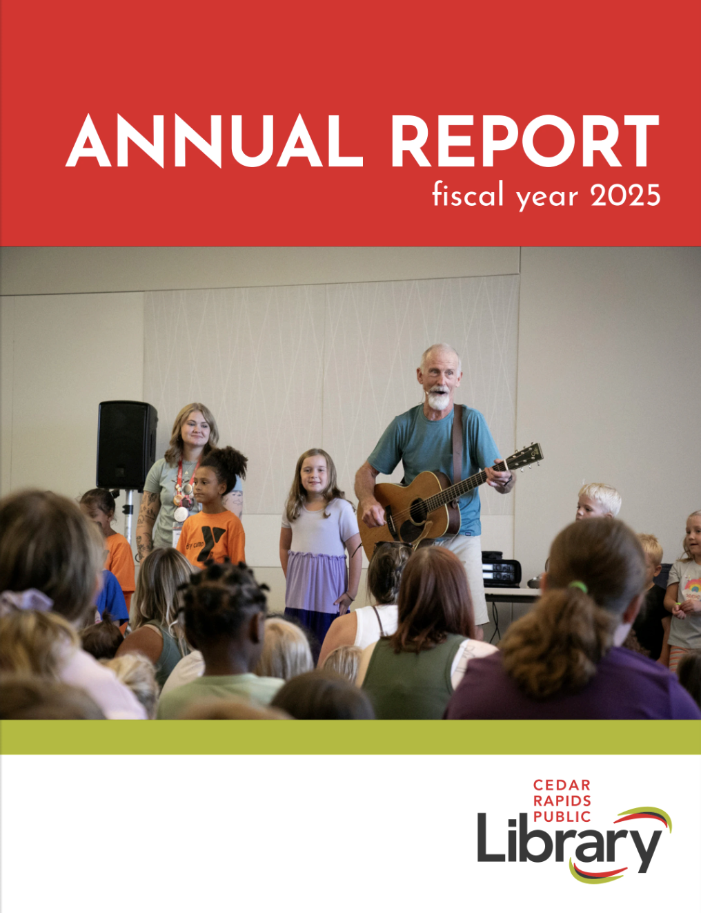 Tom Pease sings with children at the Downtown Library.
