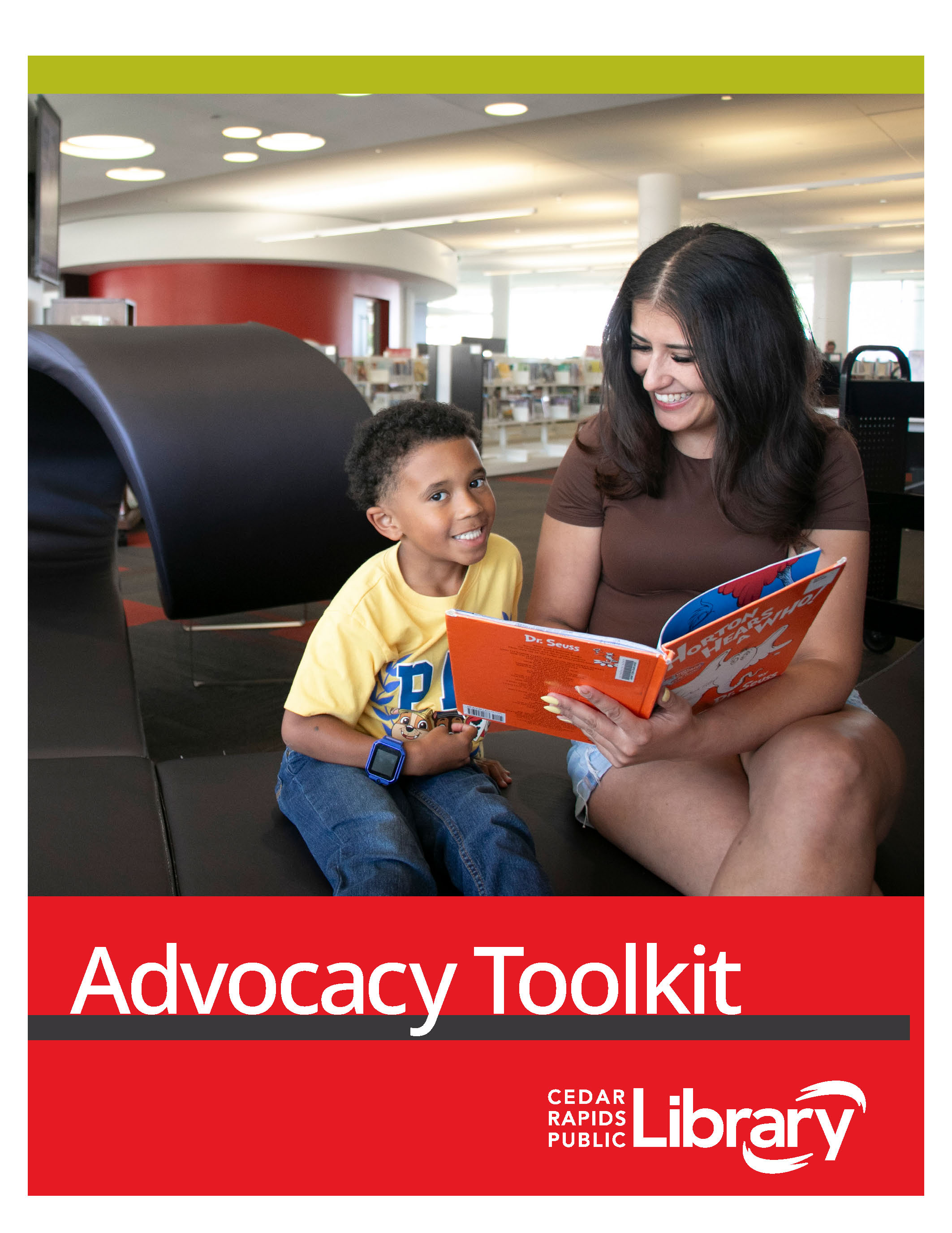 Woman and child reading a book which is on the cover of the advocacy toolkit