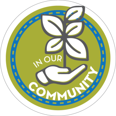 A graphic is a green circle with a hand holding a plant and the words "In our community."