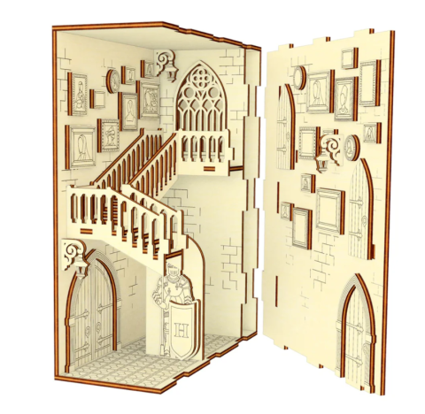 interior of wooden castle book nook showing pictures, staircase, suit of armor, and stained glass window.