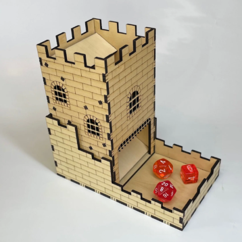 Image of a wooden dice tower that has engraved bricks. Three red dice sit on the bottom of the tower.