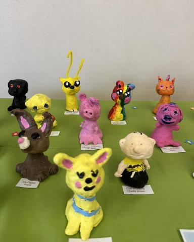 Clay creatures made by area third graders.