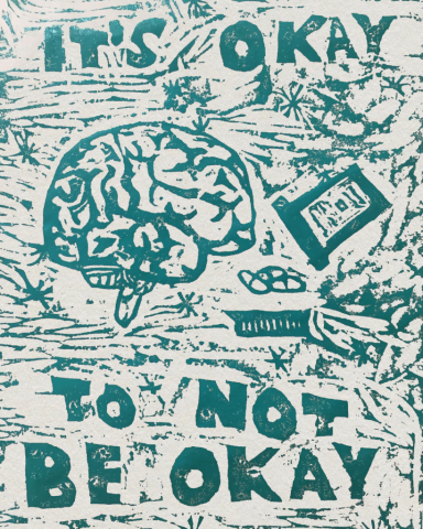 An art print says "It's okay to not be okay" with a brain and other items carved out in green on a white background.