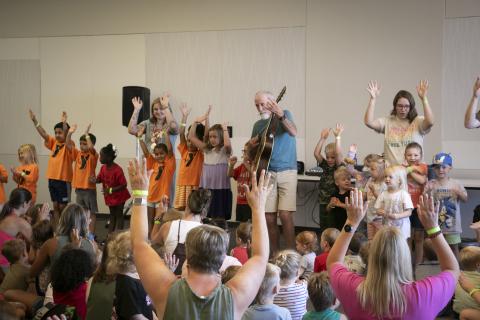 Tom Pease and children dance at the Downtown Library.