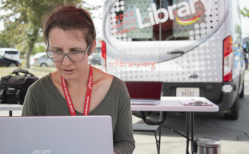 Librarian working the job fair booth