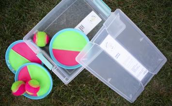 container with ball and catch kit inside