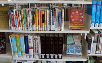 book shelf with display of entrepreneur books